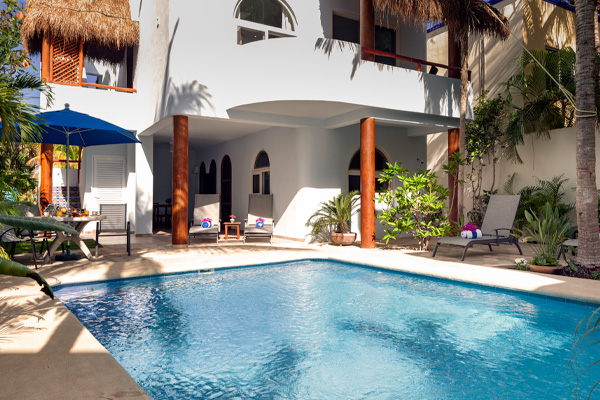 Shared pool area with lounge chairs and shaded patio at Casa Sonoma.