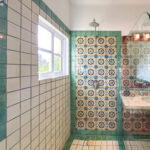 Casa Zarah bathroom with colorful Mexican tiles, walk-in shower, and glass partition.