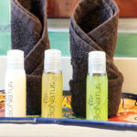 BioNatur toiletries and rolled towels on a colorful Talavera tray at Casa Zarah.