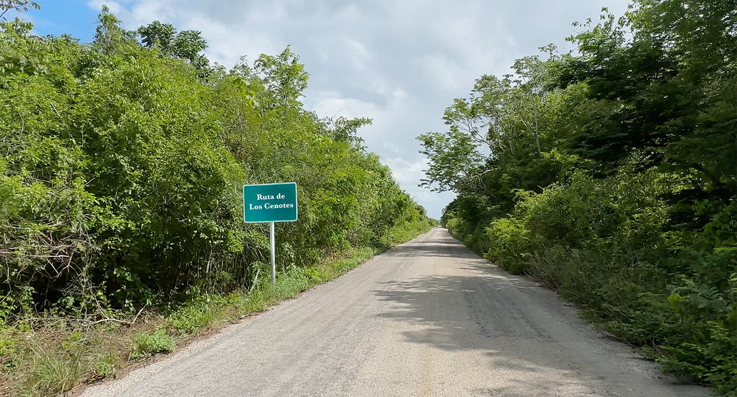 The road and sign marking the Ruta de los Cenotes near Puerto Morelos