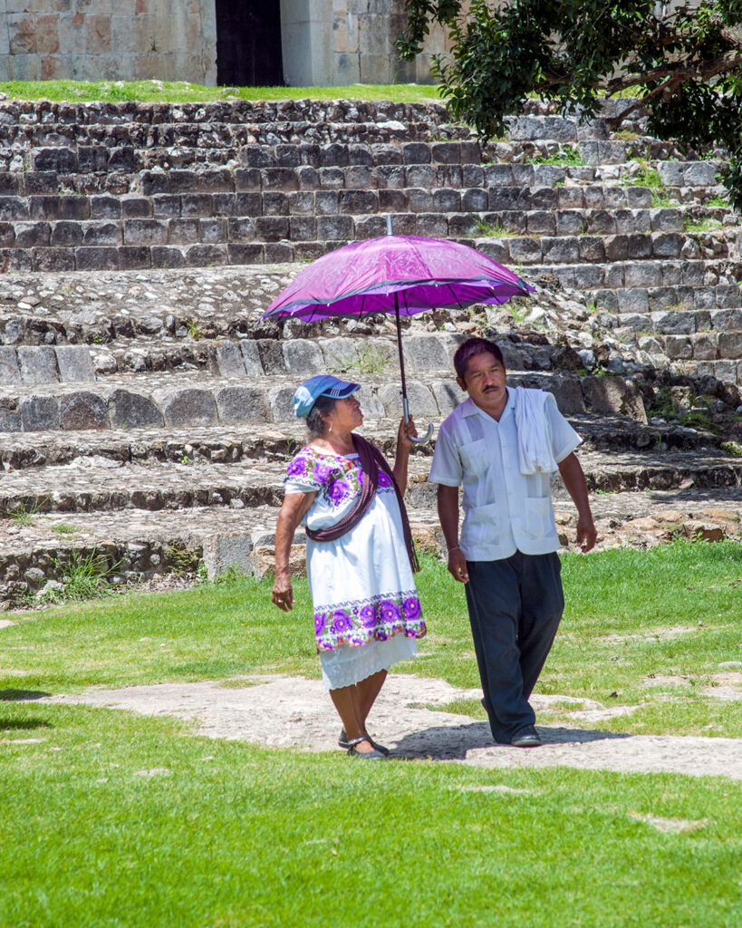This photo shows a well-preserved Maya ruin nestled in the Yucatán jungle, with stone steps and temples bathed in natural light. While many visitors see ruins as relics of a vanished past, they are part of a living culture that continues to thrive. The Maya still walk this land, honoring ancient beliefs and carrying forward a deep respect for nature and spirit.