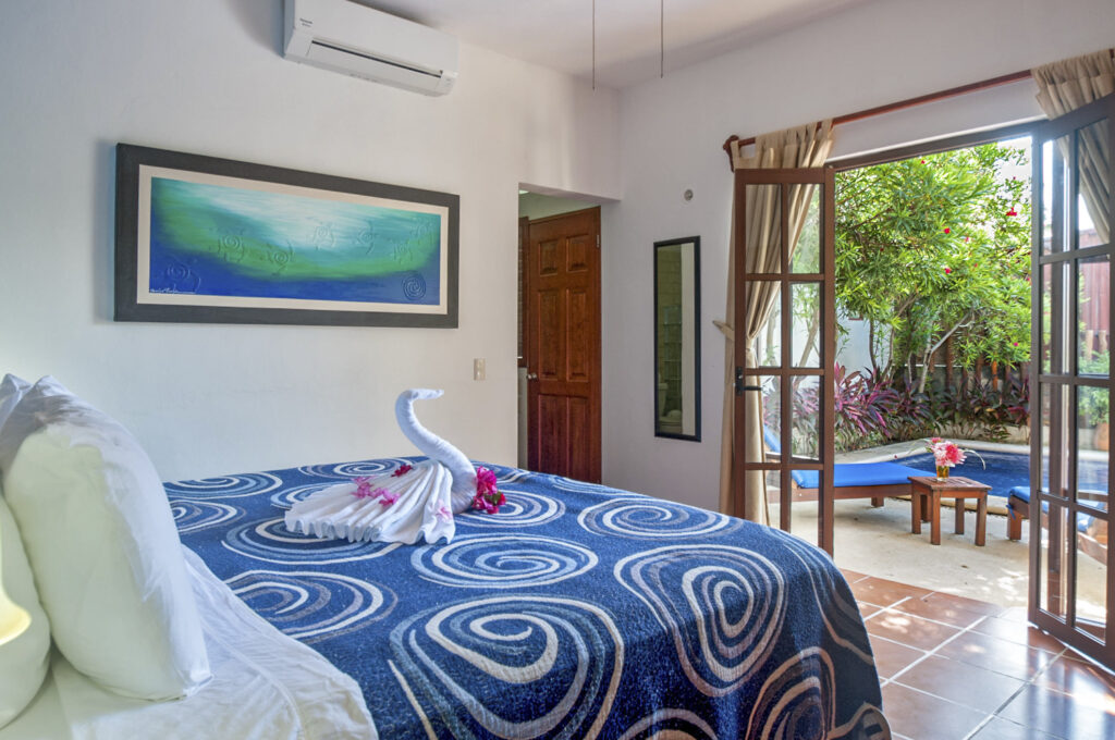 Master bedroom at Casa Anita with king bed and direct pool access