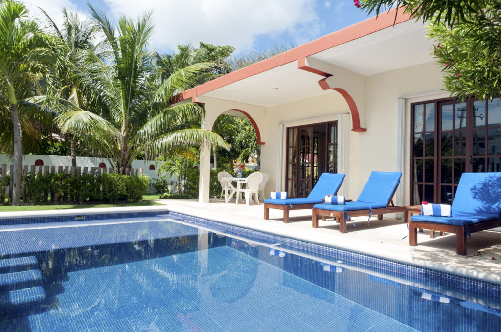 Private pool and patio area at Casa Anita with blue lounge chairs