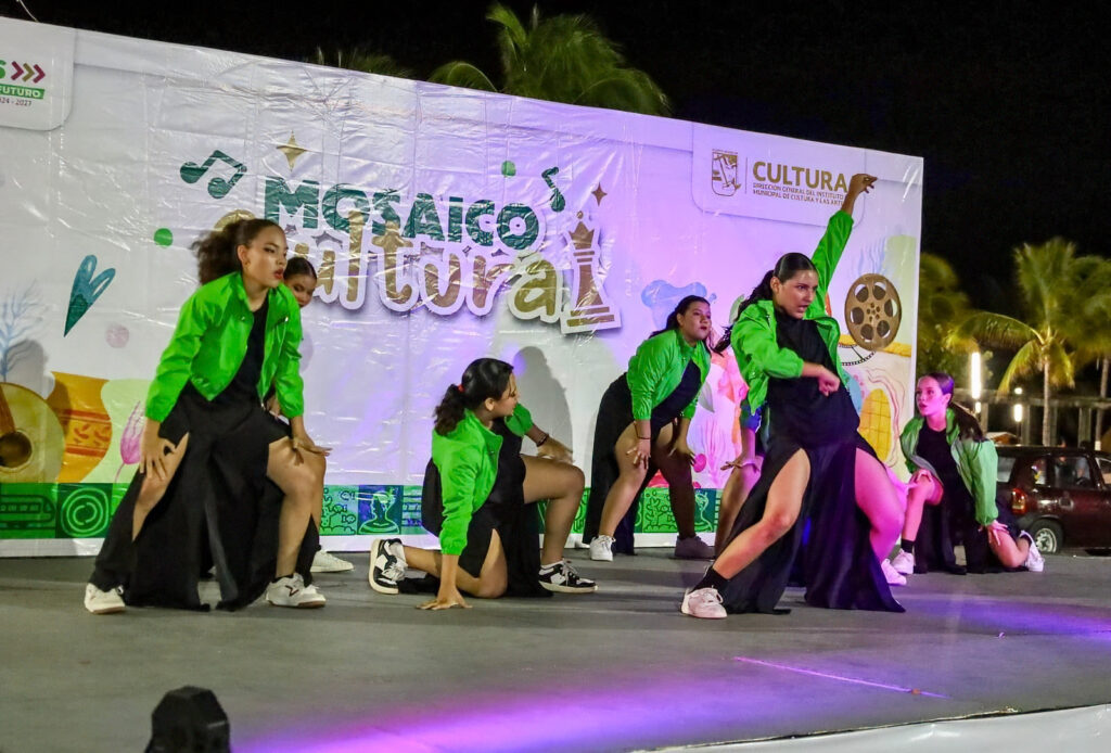 Dancers perform on stage during a cultural celebration in Puerto Morelos.
