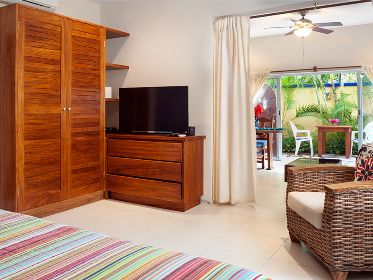Bright interior of Apartment #5 at Abbey 2 with garden view in Puerto Morelos