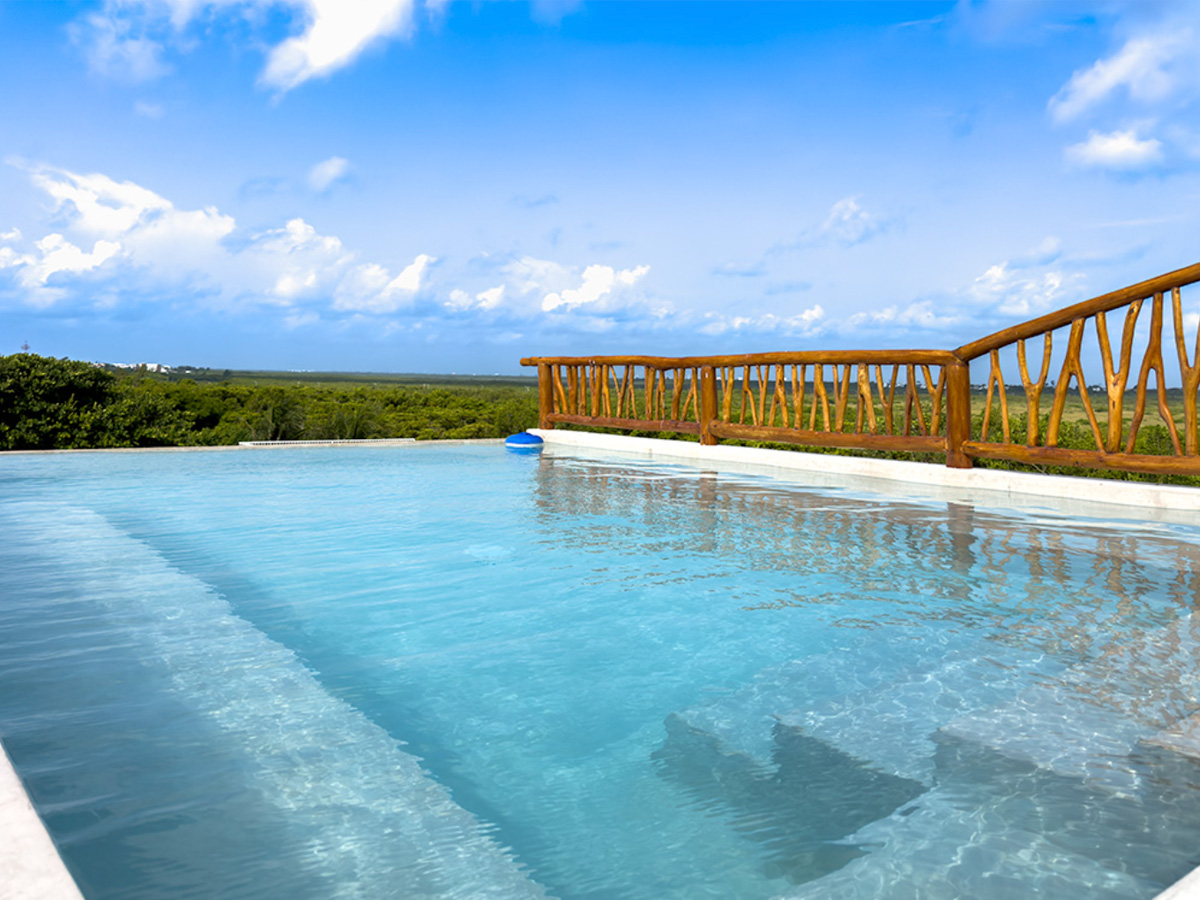 Rooftop pool at Casa Daniela with wide views in Puerto Morelos