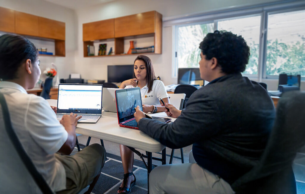 Abbey del Sol team meeting with property owners in Puerto Morelos about vacation rental management and property planning.