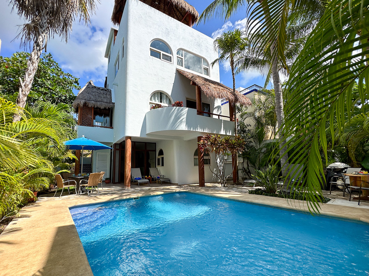 Shared pool and tropical courtyard at Casa Sonoma in Puerto Morelos