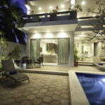 Casa Agua Azul pool and patio lit up at night.