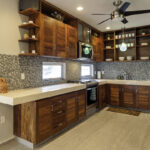Full kitchen at Casa Agua Azul with wood cabinets and stainless appliances.