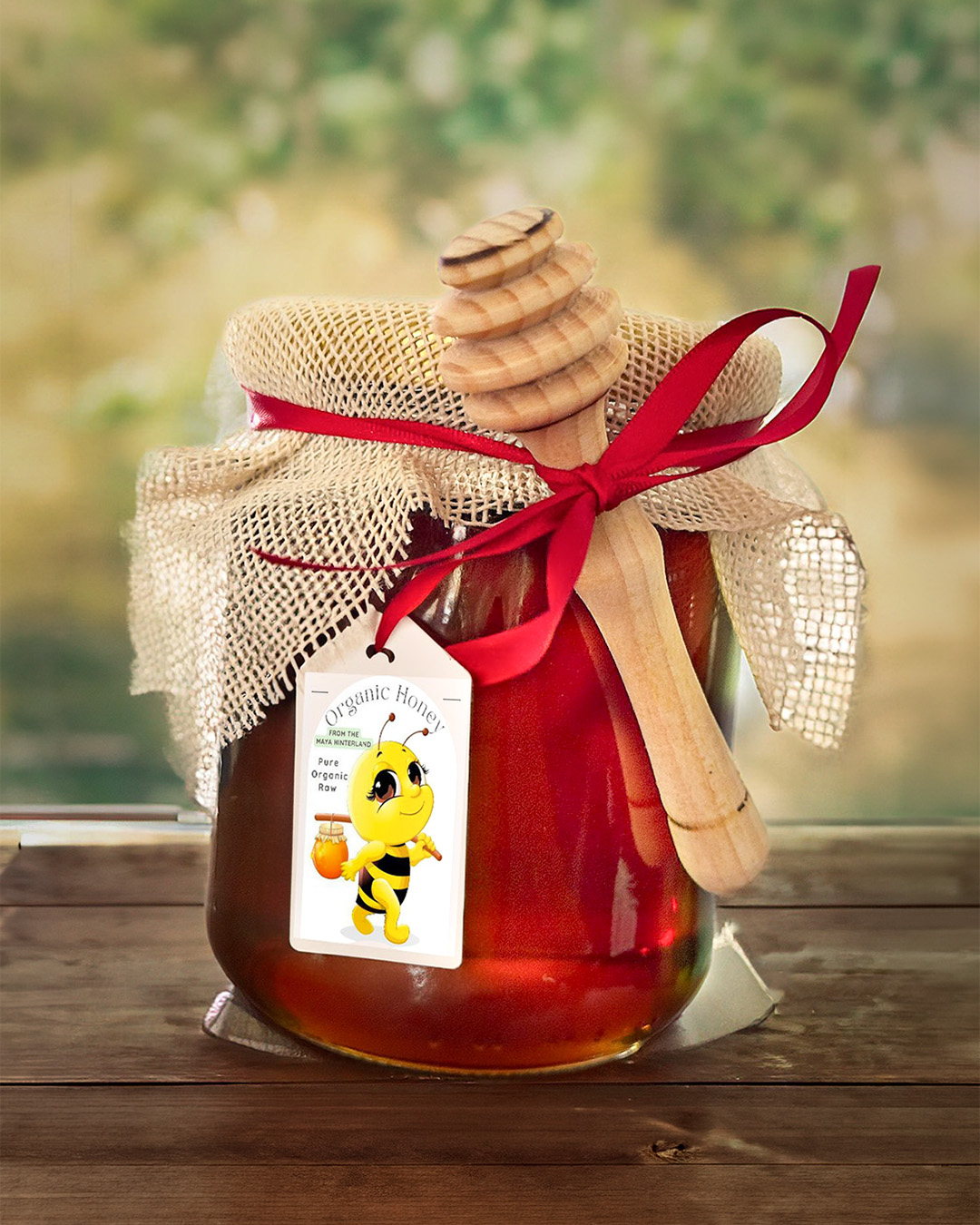 Jar of raw Maya honey wrapped with fabric and ribbon.