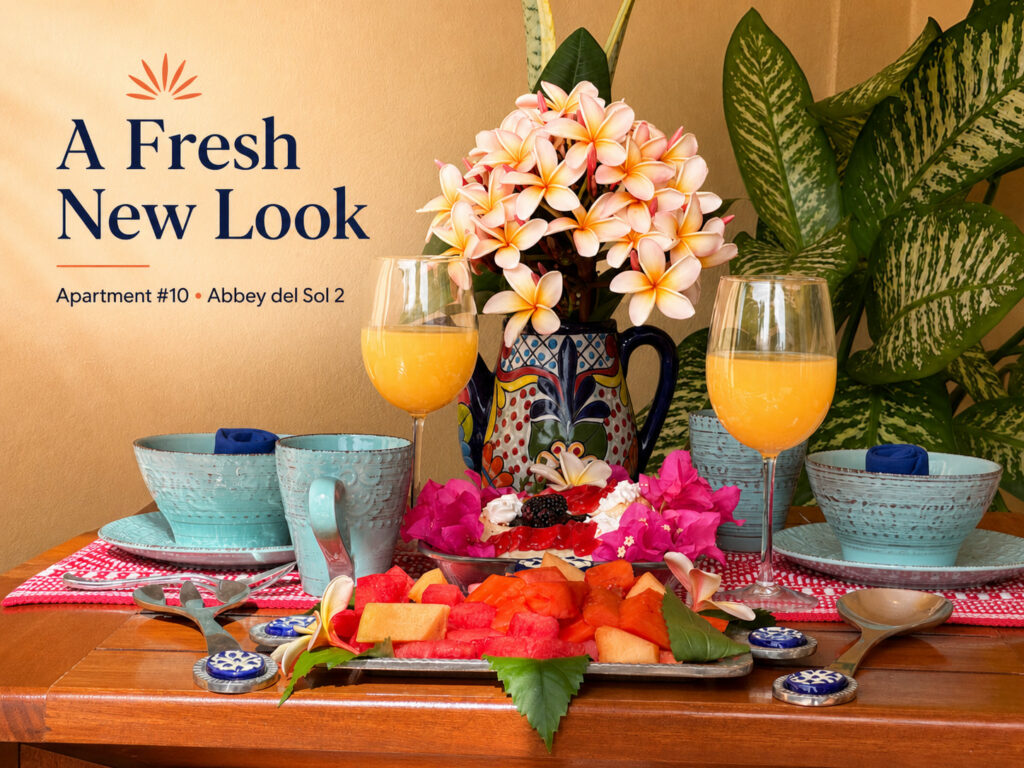 Featured image for Apartment #10 at Abbey del Sol 2, showing a colorful tropical table setting with flowers and fresh fruit.