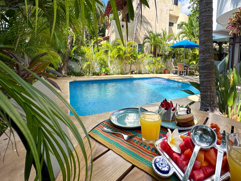 Breakfast table beside the shared pool at Casa Sonoma
