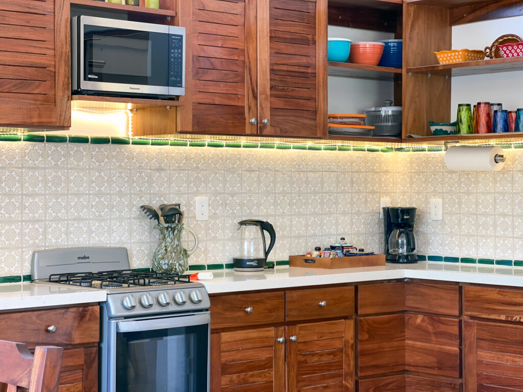 Full kitchen with wooden cabinets and appliances at Casa Catalina #2