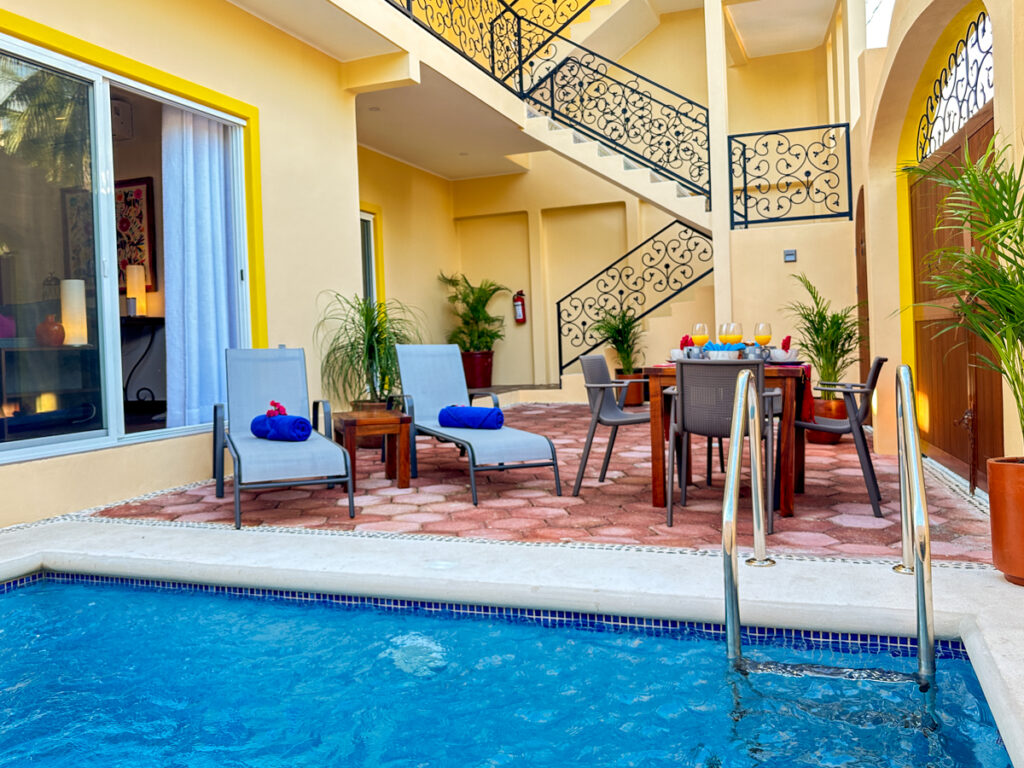 Shared pool courtyard and stairway at Casa Catalina in Puerto Morelos