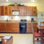 Full kitchen and dining area in Abbey del Sol Apartment #8