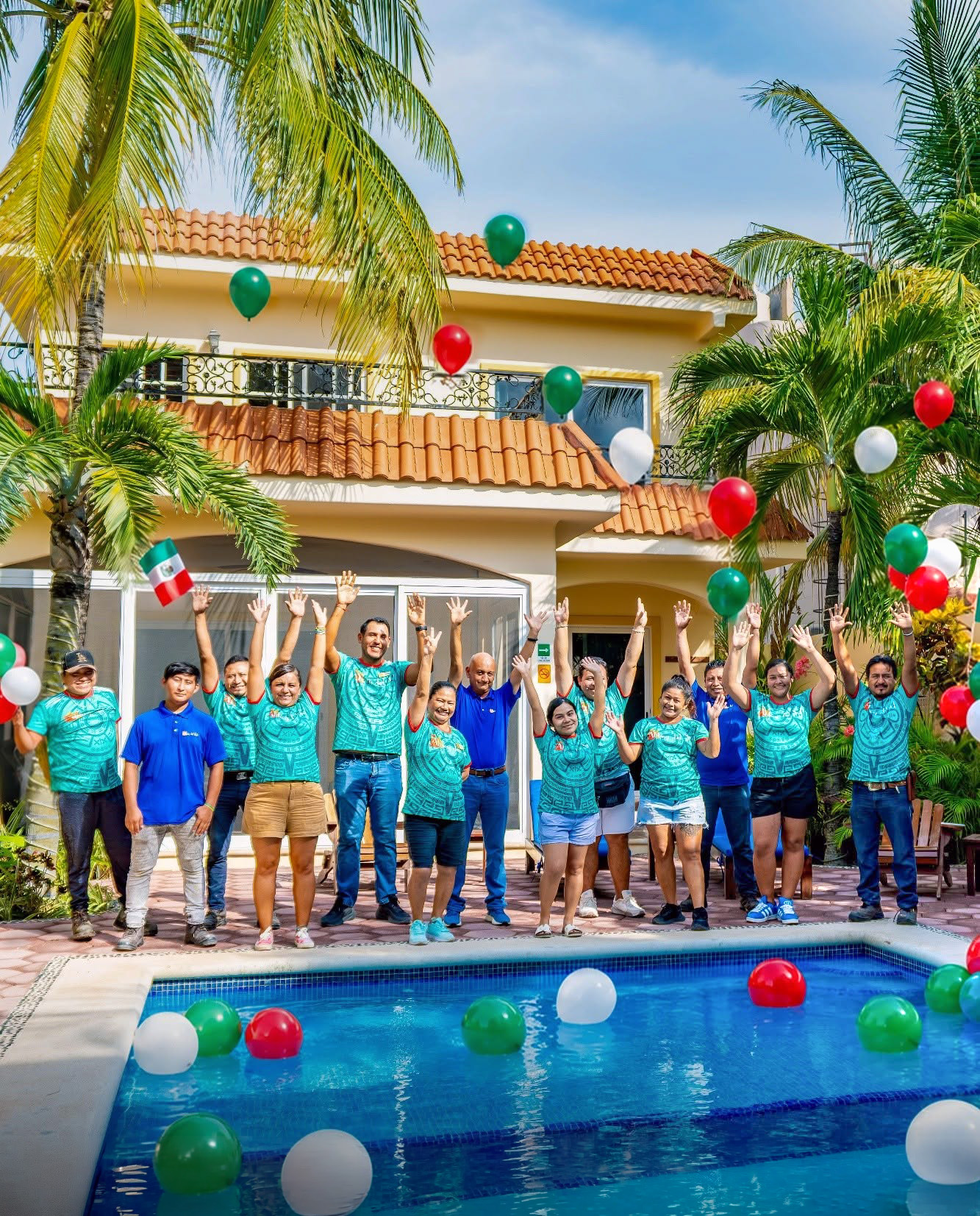 The Abbey del Sol team together beside the pool